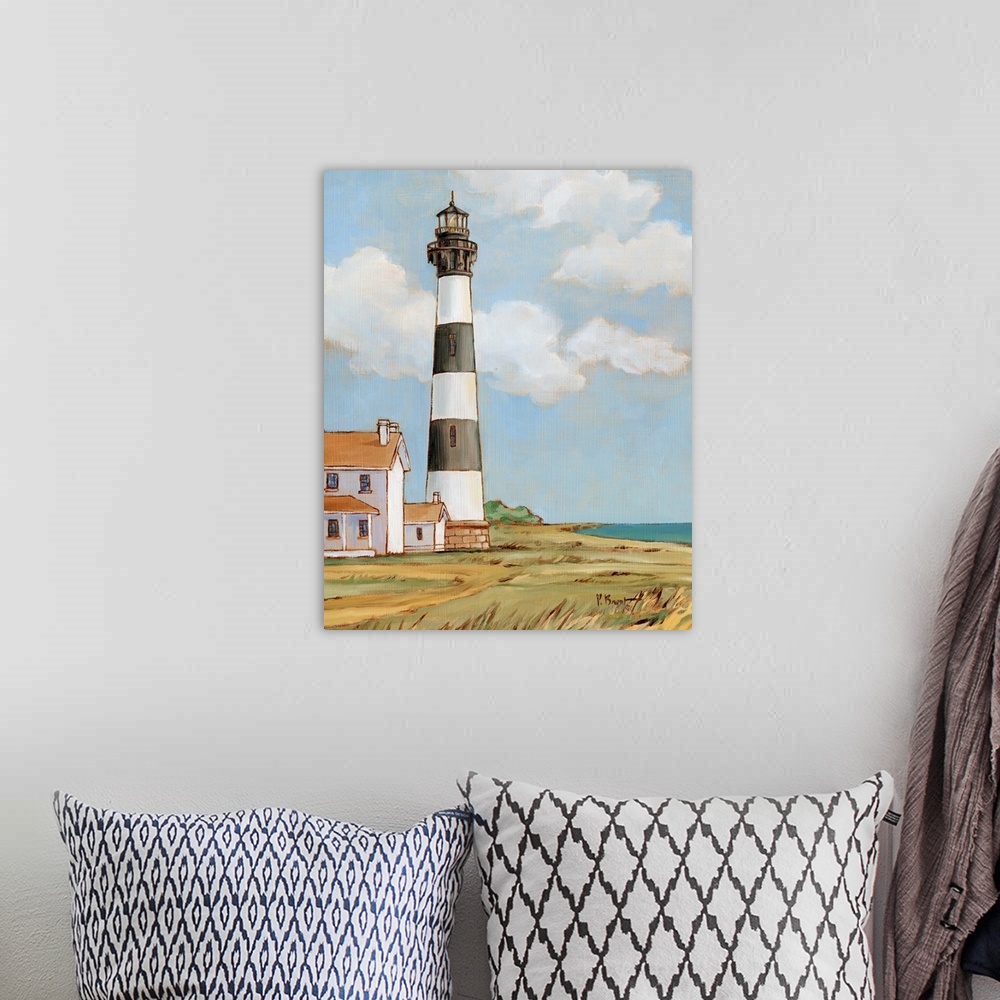 A bohemian room featuring Painting of the striped Bodie Island lighthouse on the Outer Banks against a cloudy sky.