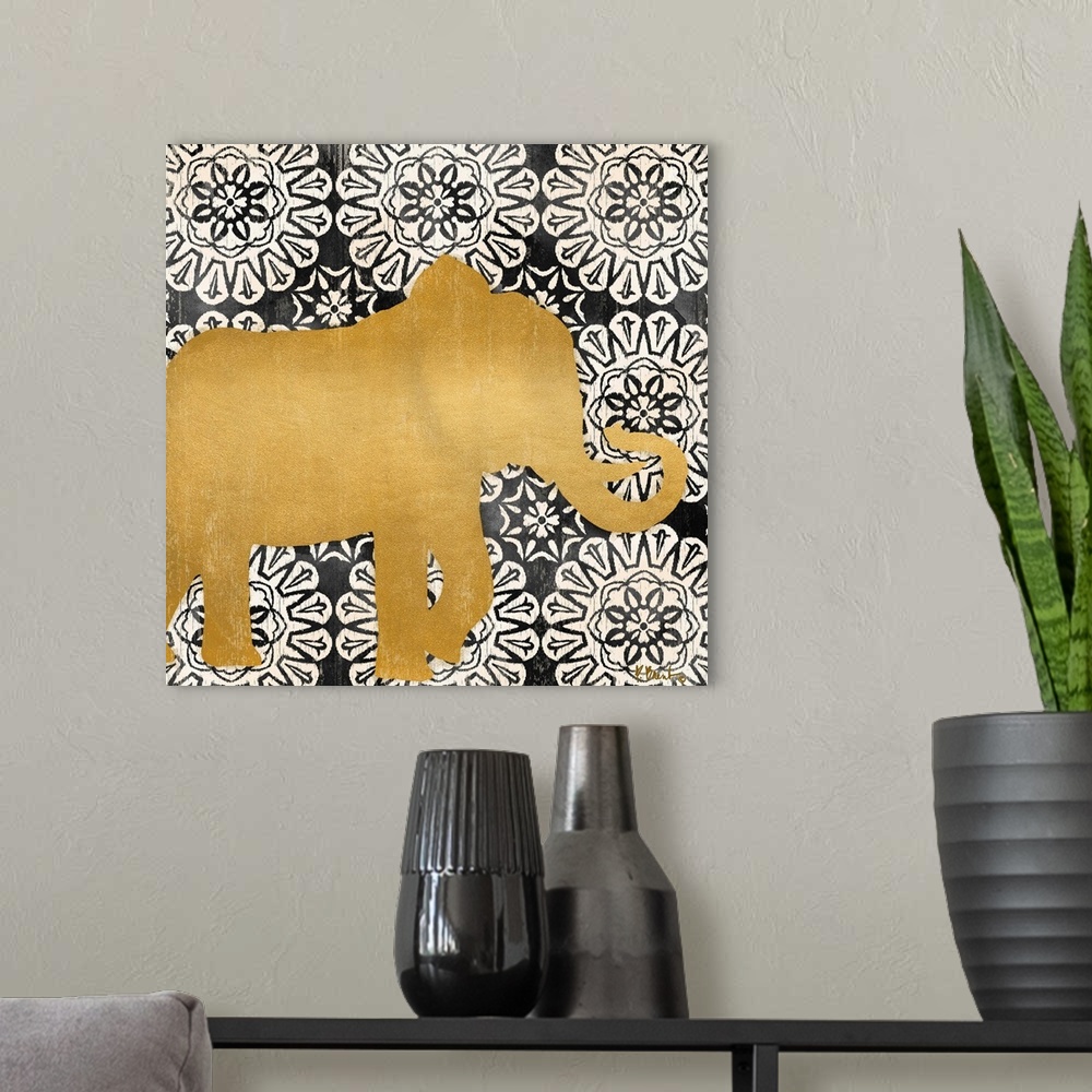 A modern room featuring Square decor with a metallic gold silhouette of an elephant on a black and white mandela patterne...