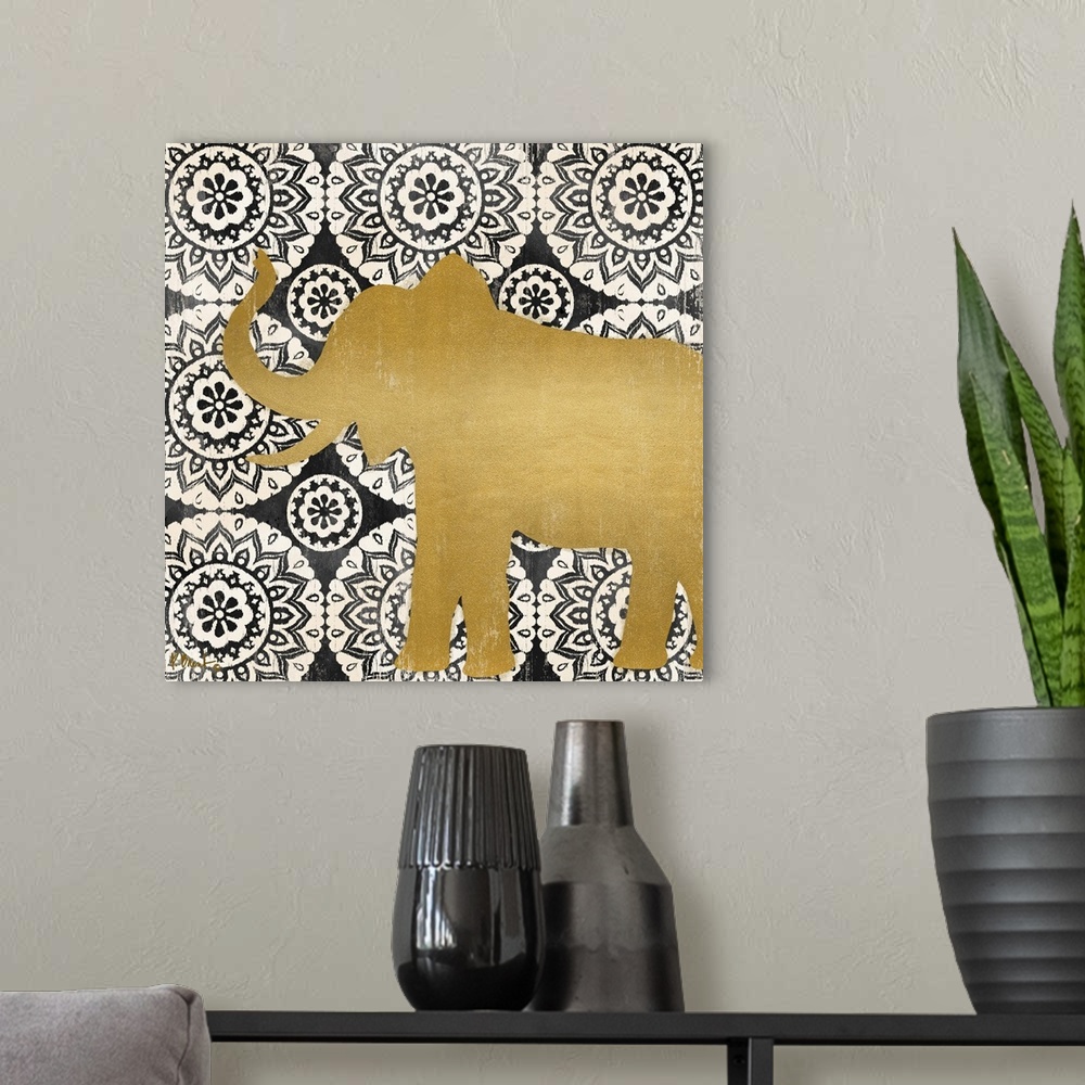 A modern room featuring Square decor with a metallic gold silhouette of an elephant on a black and white mandela patterne...