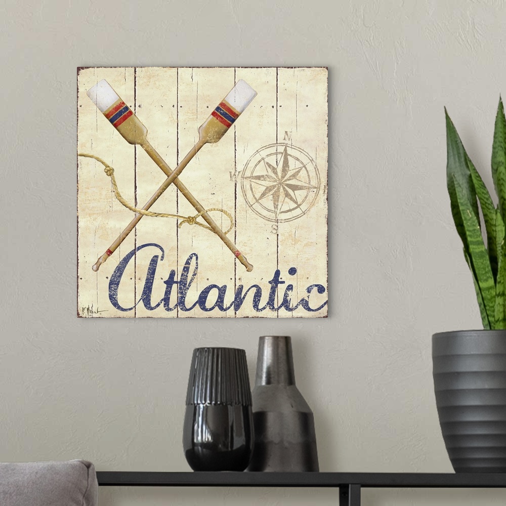 A modern room featuring Painted nautical sign on wood panels with a compass rose, oars, and the word Atlantic.