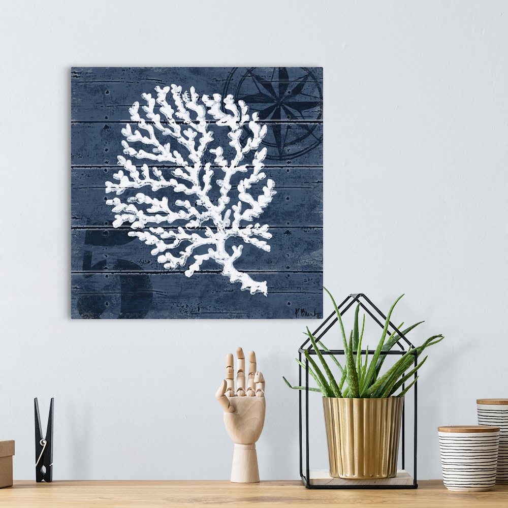 A bohemian room featuring Contemporary decorative artwork of a coral illustration on a dark, nautical background.