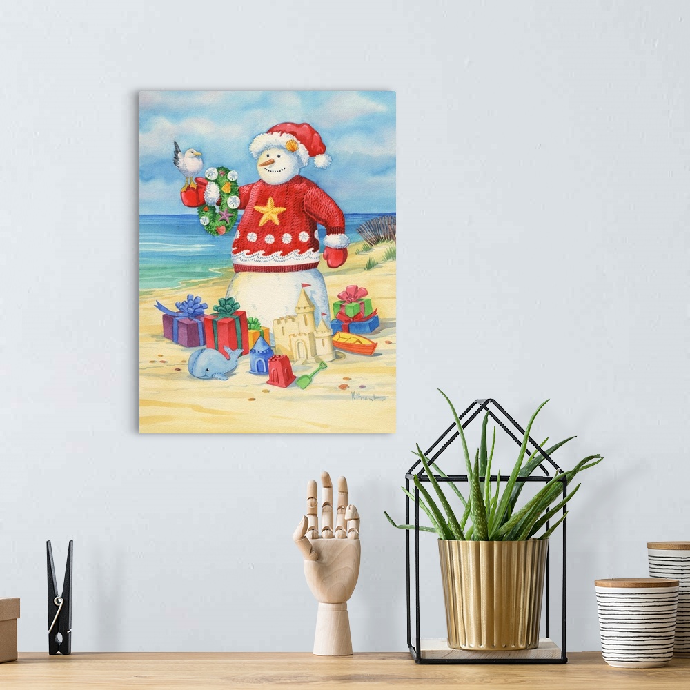 A bohemian room featuring A "snow" man on the beach surrounded by presents and wearing a festive sweater.