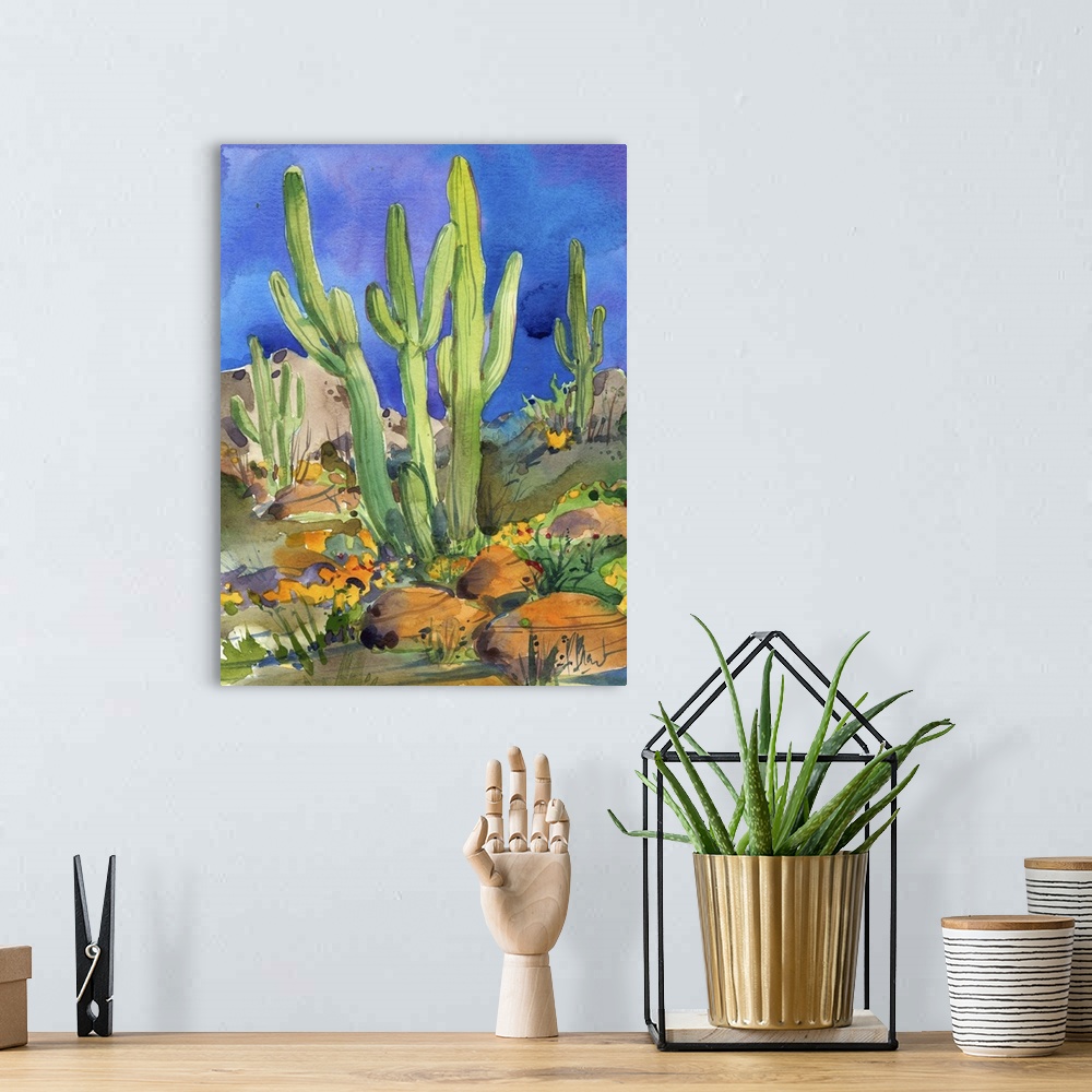 A bohemian room featuring Watercolor painting of saguaro cacti in a rocky desert.