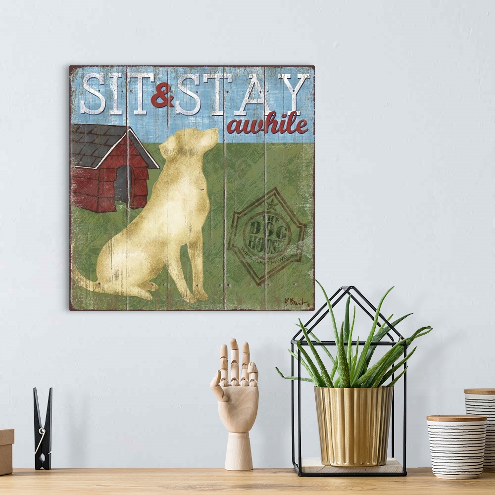 A bohemian room featuring Contemporary decorative artwork of a labrador dog next to a doghouse with the words "sit and stay...