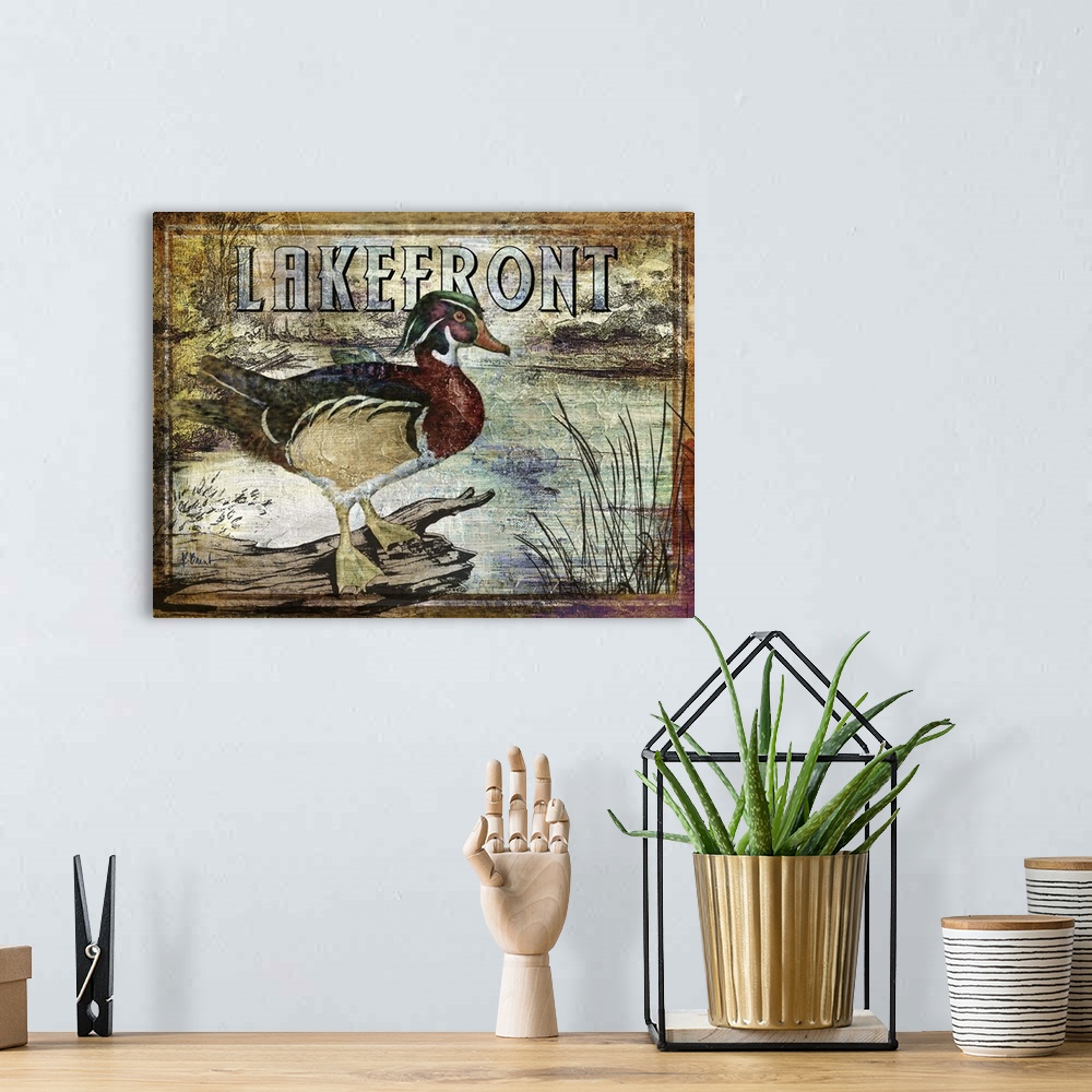 A bohemian room featuring Textured sign with a wood duck drake in a river with the text Lakefront.