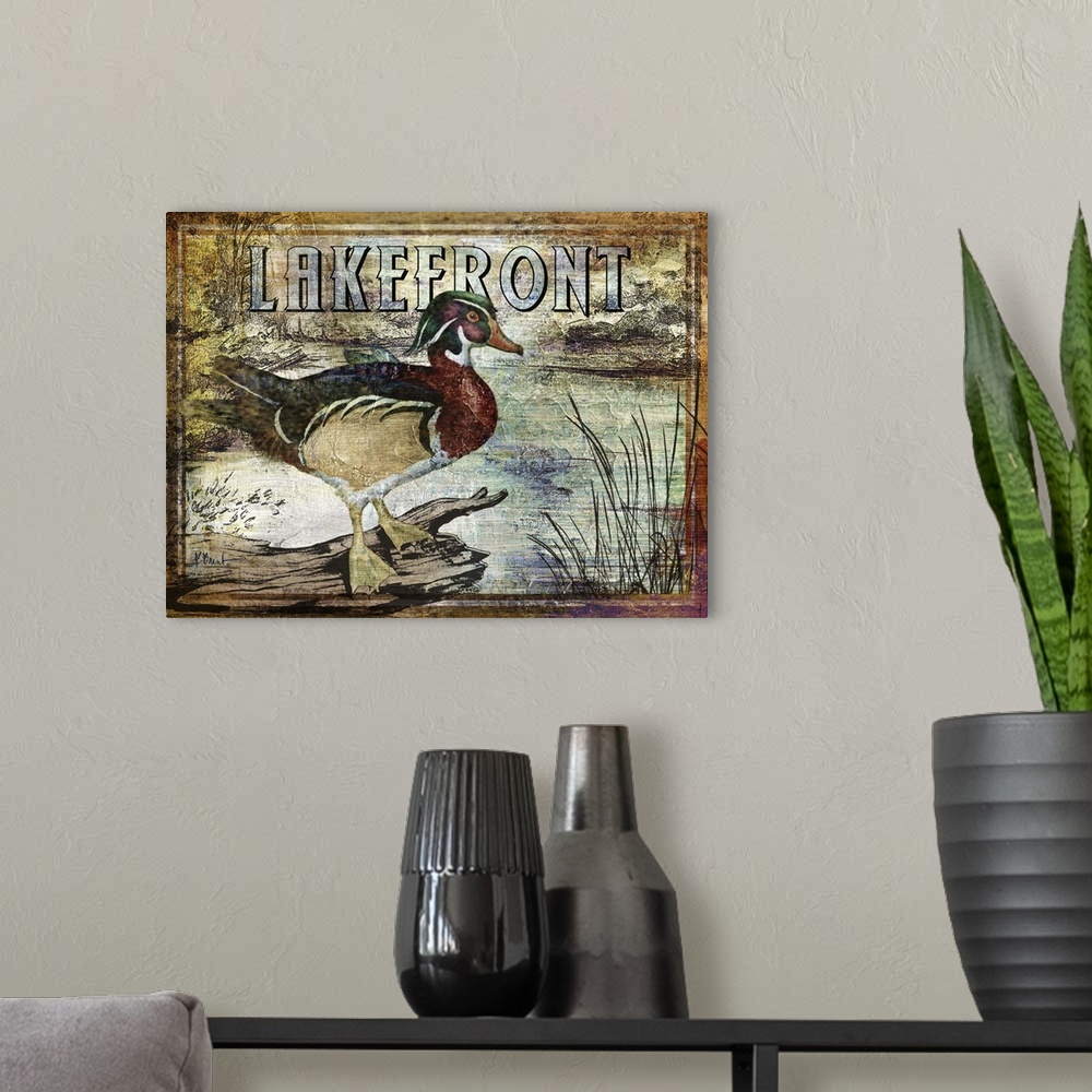 A modern room featuring Textured sign with a wood duck drake in a river with the text Lakefront.