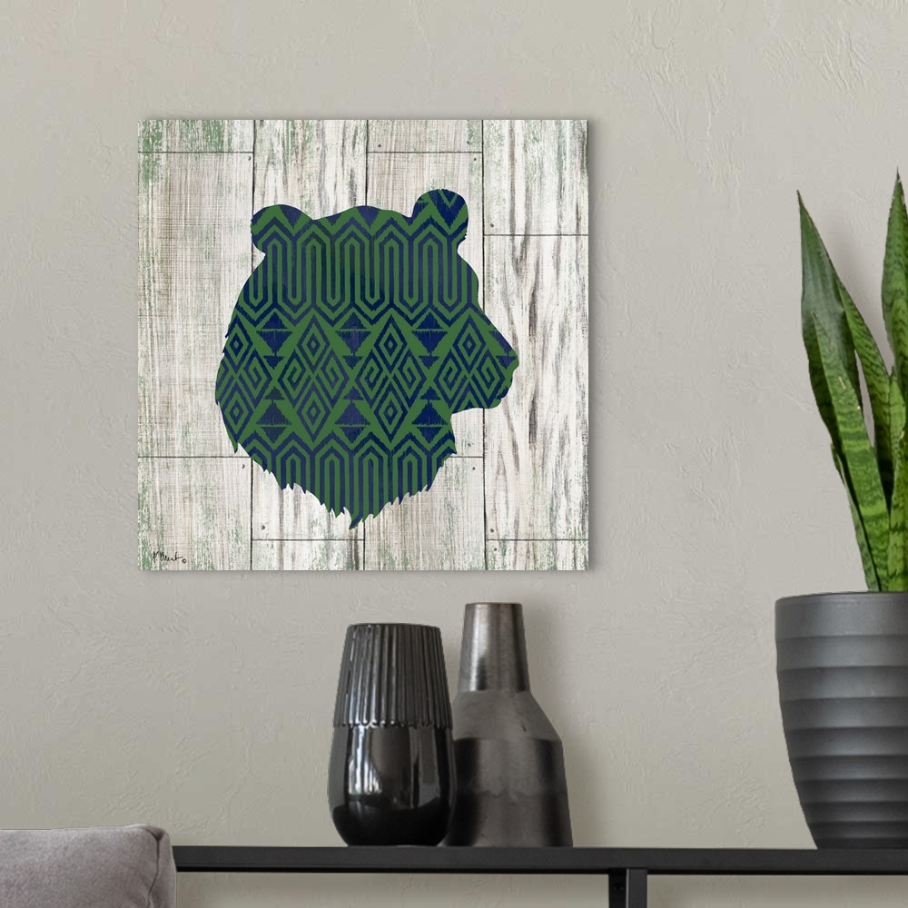 A modern room featuring Square cabin decor with a blue and green patterned silhouette of a bear on a faux distressed wood...