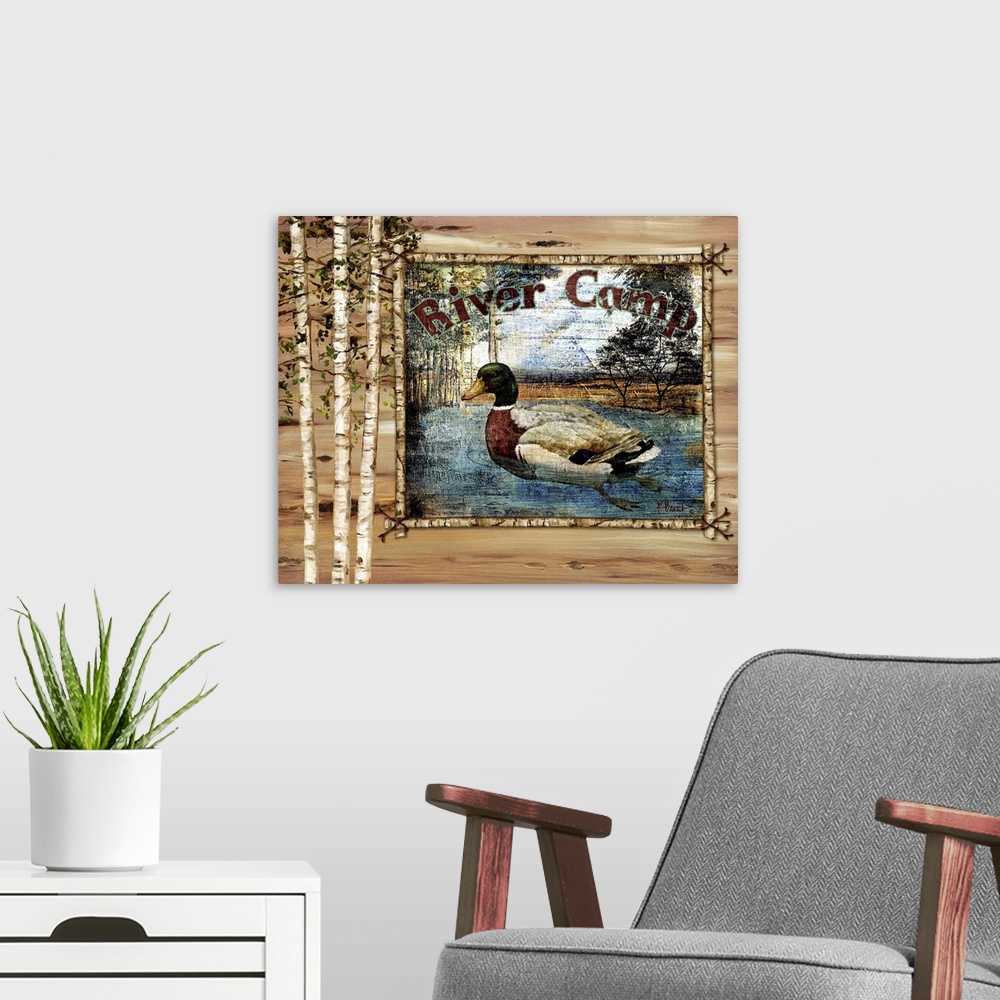 A modern room featuring Decorative artwork of a duck in a frame, with birch trees and the words River Camp.