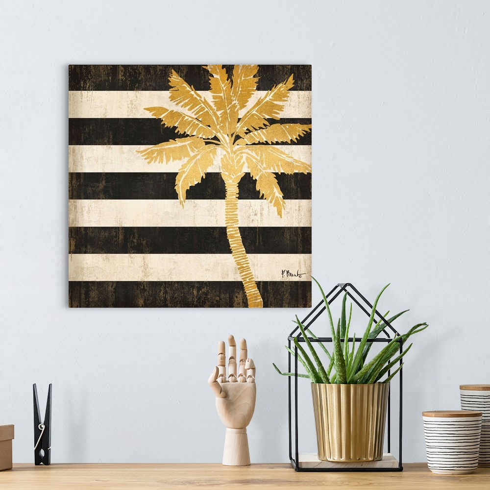 A bohemian room featuring Square decor with a metallic gold palm tree on a black and white striped background.