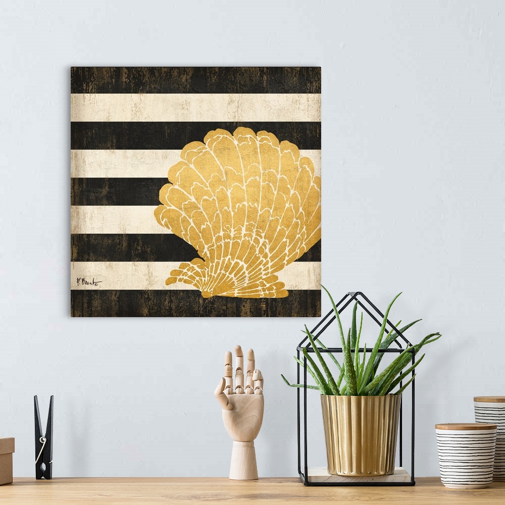 A bohemian room featuring Square decor with a metallic gold seashell on a black and white striped background.