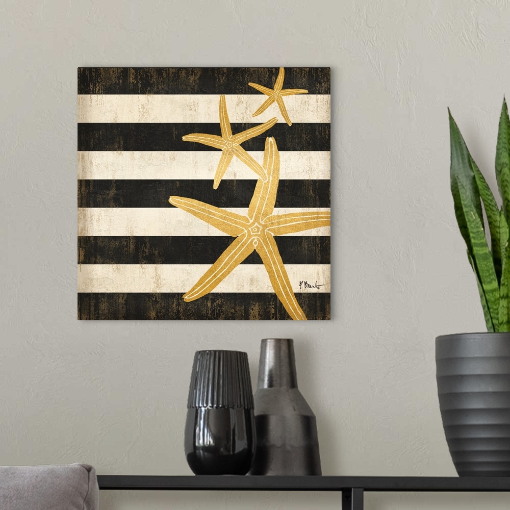 A modern room featuring Square decor with metallic gold starfish on a black and white striped background.