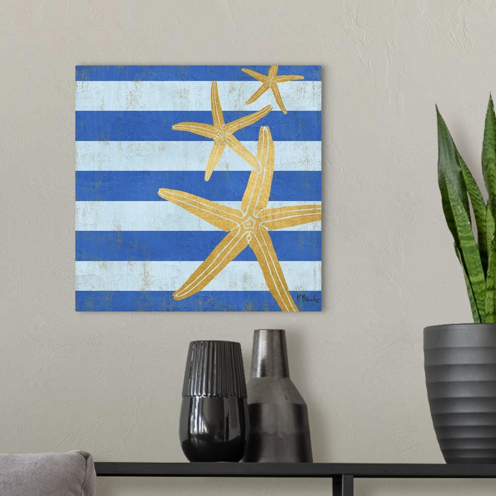 A modern room featuring Square decor with metallic gold starfish on a blue striped background.