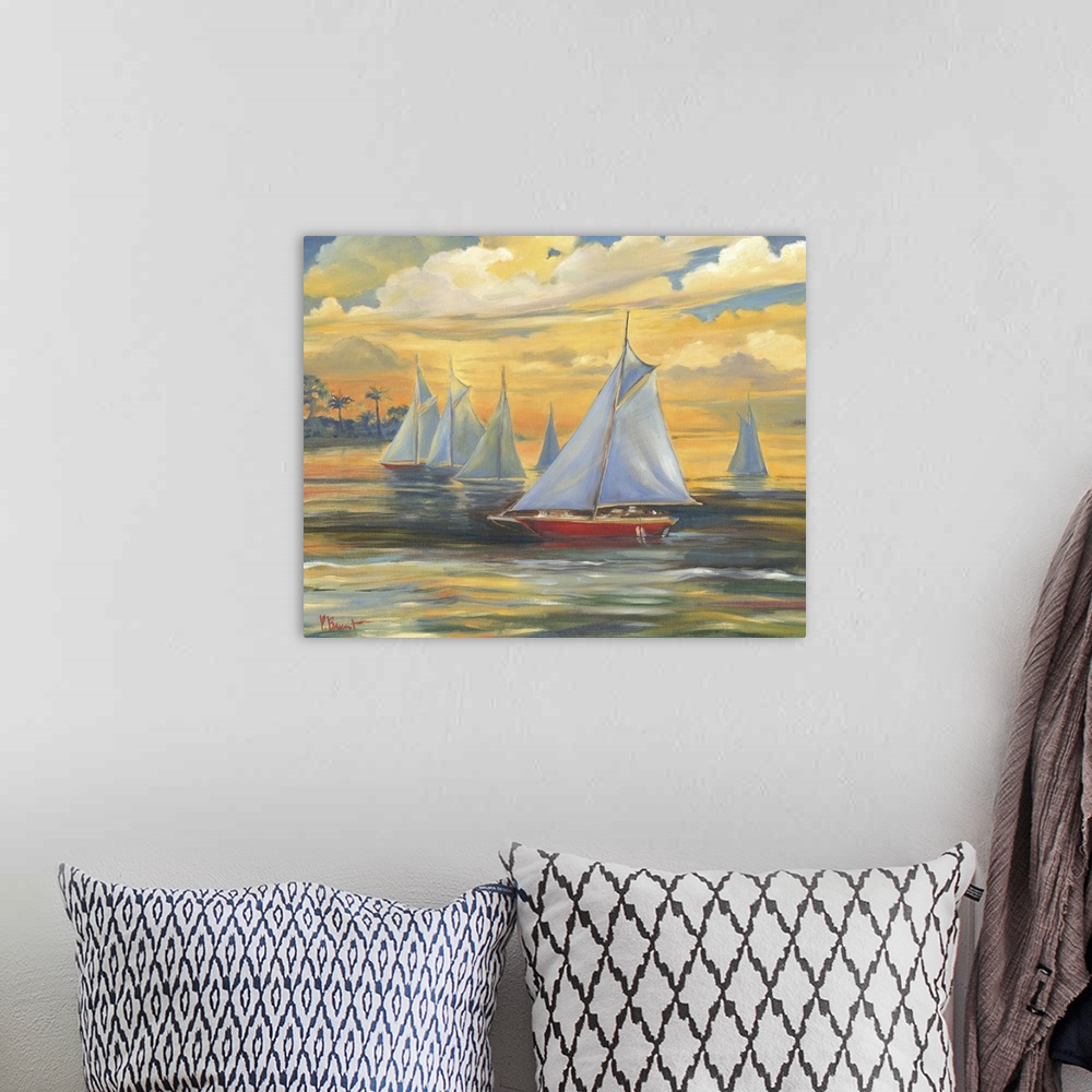 A bohemian room featuring Painting of a fleet of sailboats on the ocean at sunset, with glowing clouds.