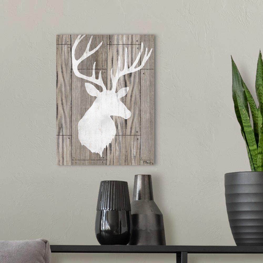 A modern room featuring Contemporary decorative artwork of a light deer silhouette on a textured wooden background.