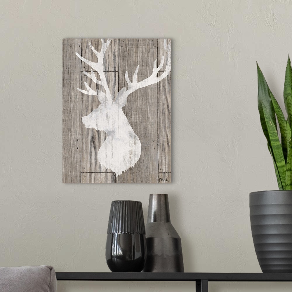 A modern room featuring Contemporary decorative artwork of a light deer silhouette on a textured wooden background.