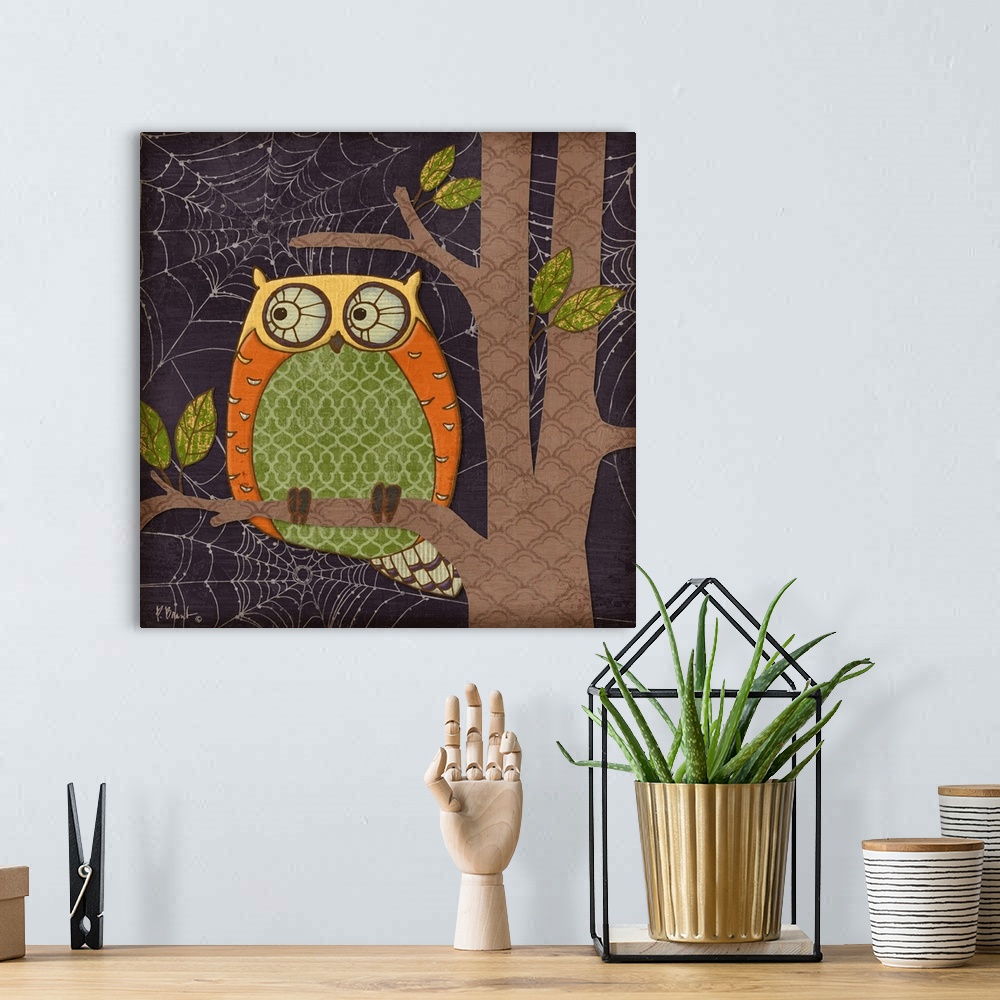 A bohemian room featuring Halloween-themed illustration of a cute owl sitting in a tree, made of patterned shapes.