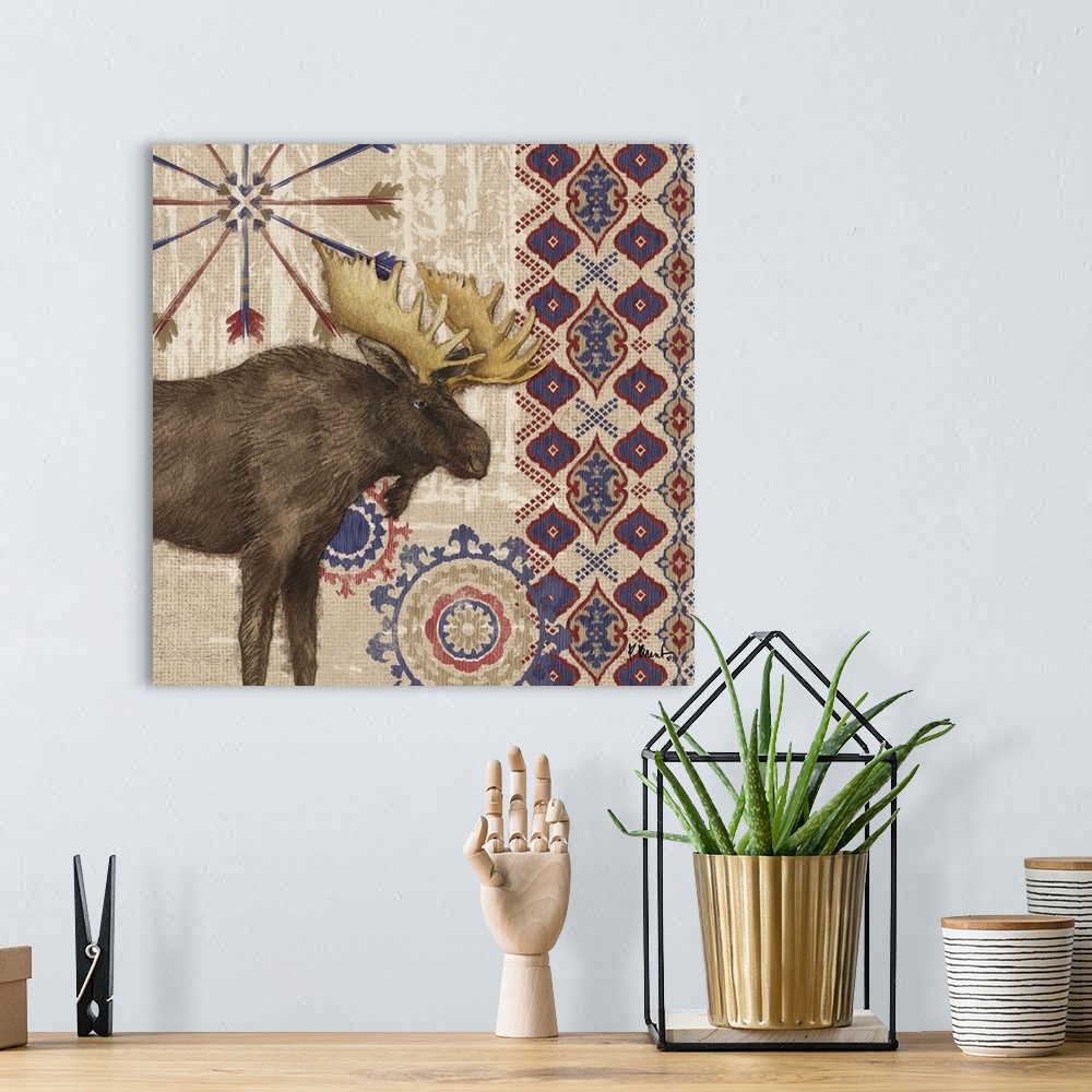 A bohemian room featuring Decorative artwork of a moose with folk patterns and arrows on a wood texture.