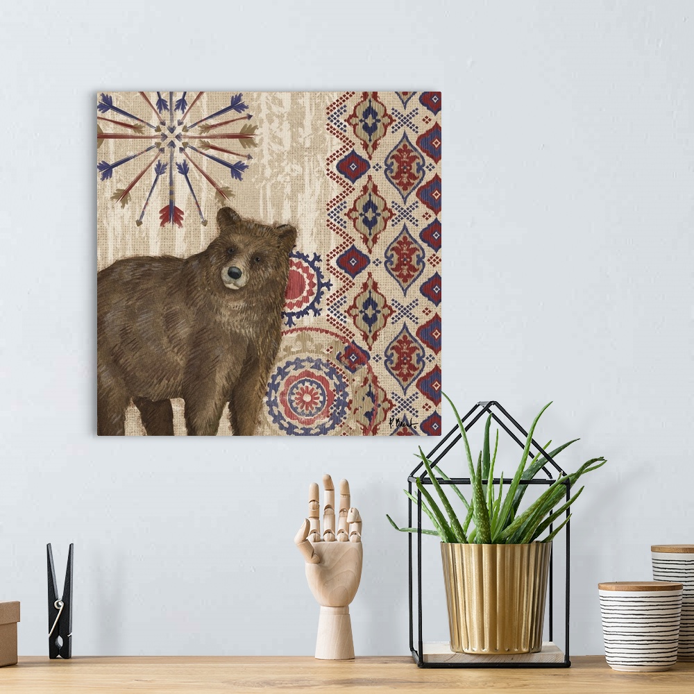 A bohemian room featuring Decorative artwork of a bear with folk patterns and arrows on a wood texture.