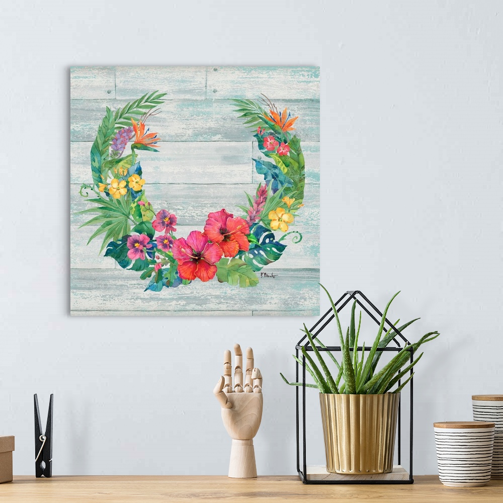 A bohemian room featuring Square decor with a wreath made of tropical flowers and leaves on a faux wood background.