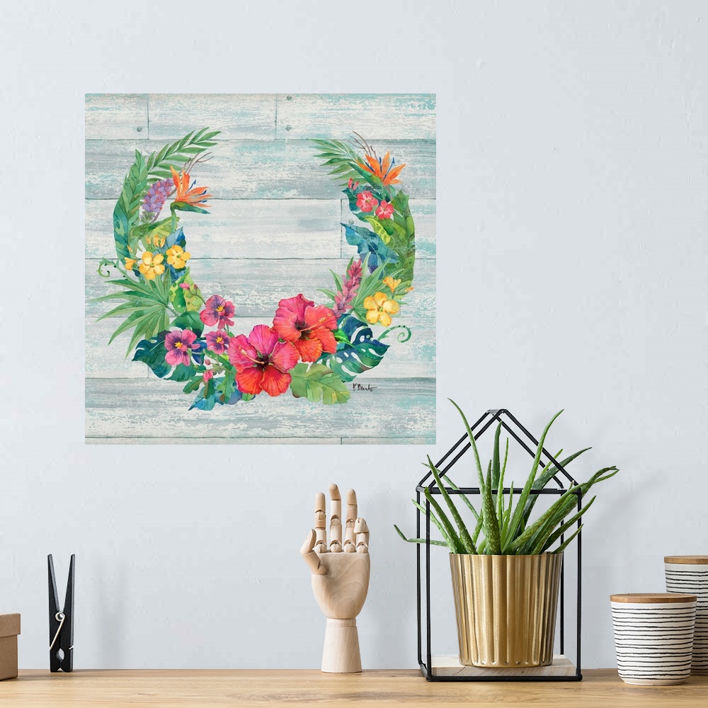 A bohemian room featuring Square decor with a wreath made of tropical flowers and leaves on a faux wood background.