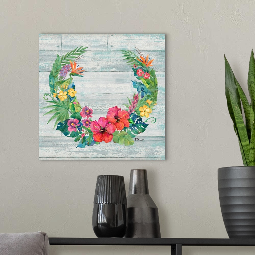 A modern room featuring Square decor with a wreath made of tropical flowers and leaves on a faux wood background.