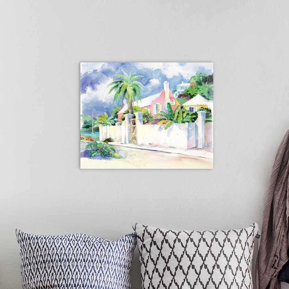 A bohemian room featuring Contemporary painting of a house on an island with stone walls and palm trees.