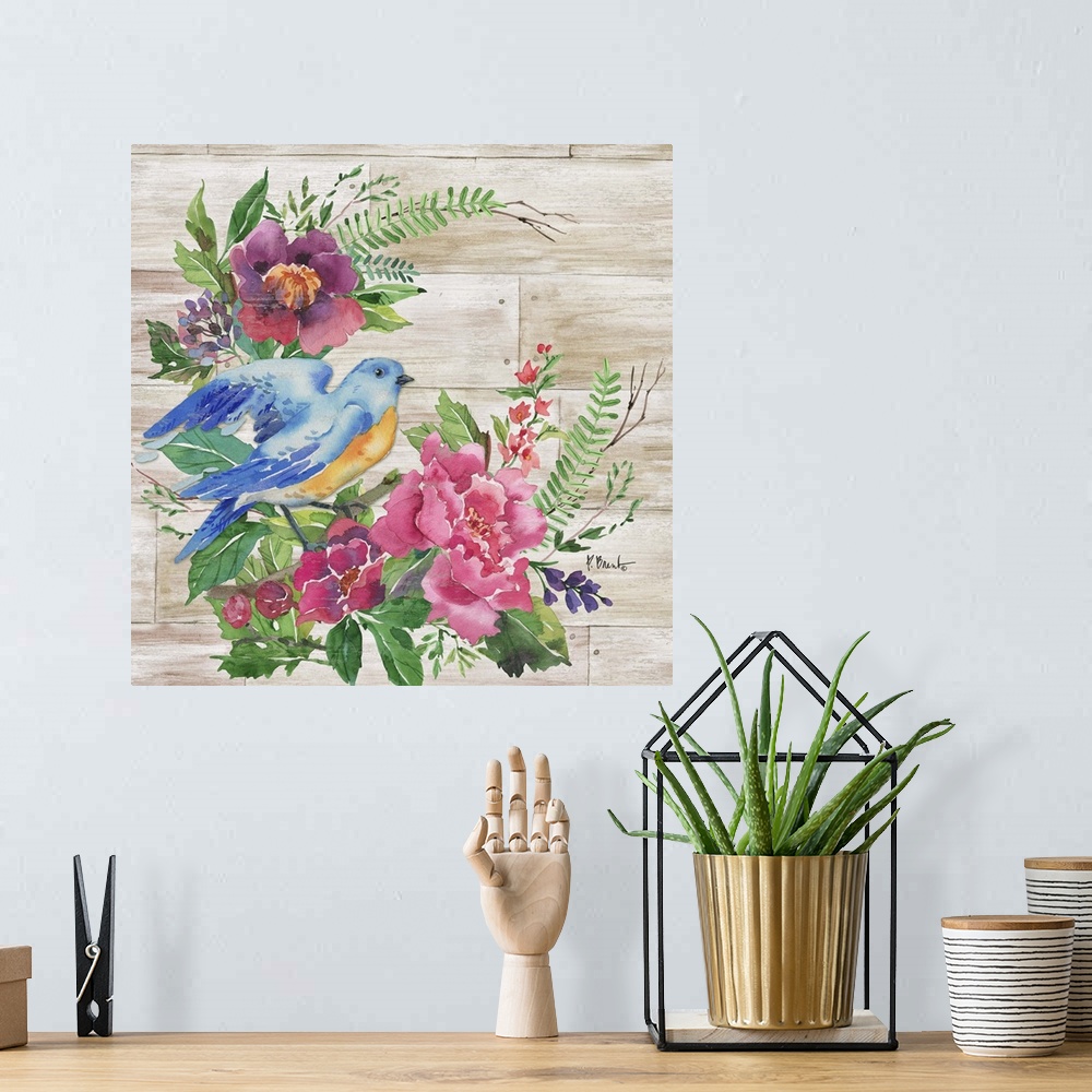 A bohemian room featuring Square decor with watercolor painted flowers and a blue and orange bird on a faux wood background.