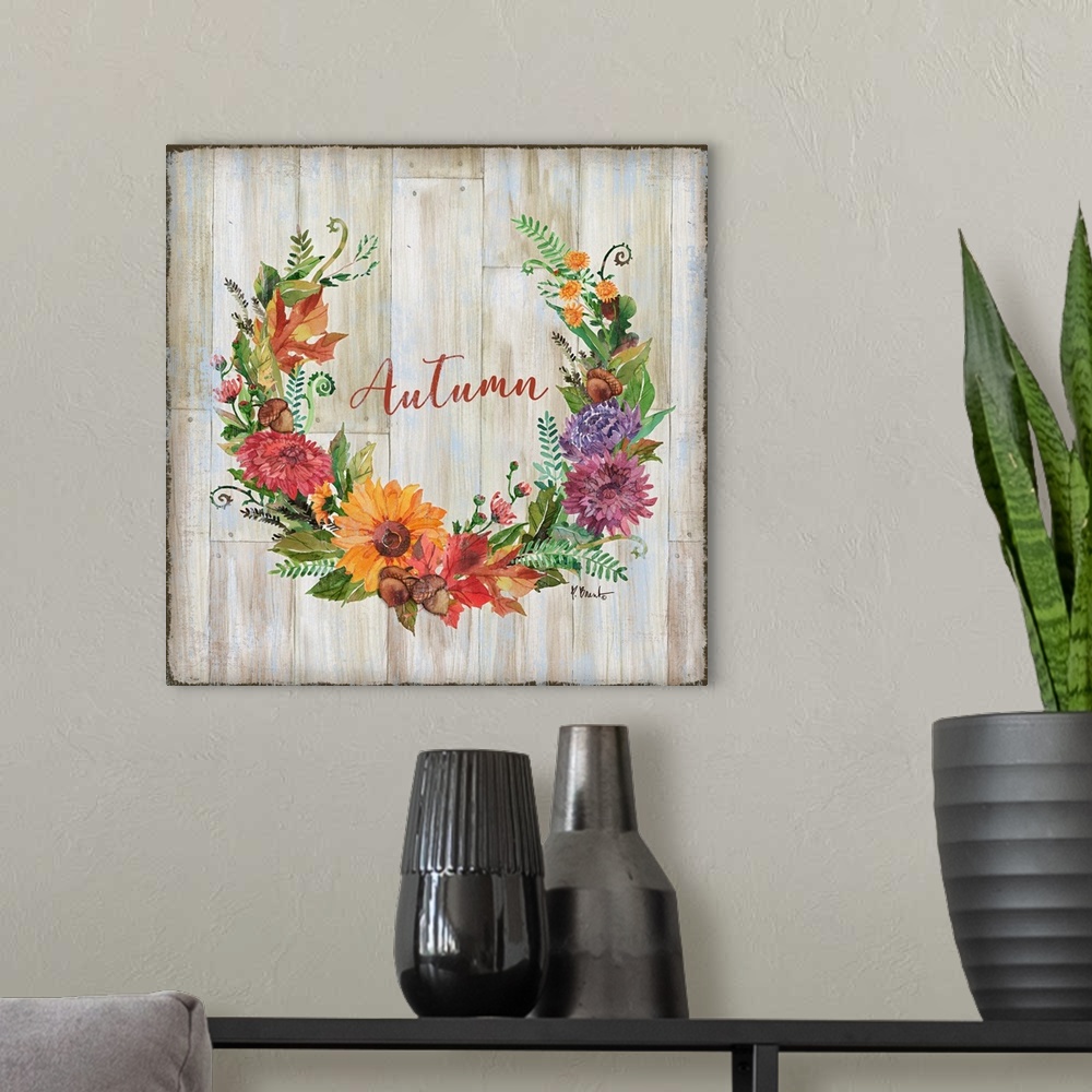 A modern room featuring Square decor with a wreath made of Autumn flowers and greens on a faux wood background with "Autu...