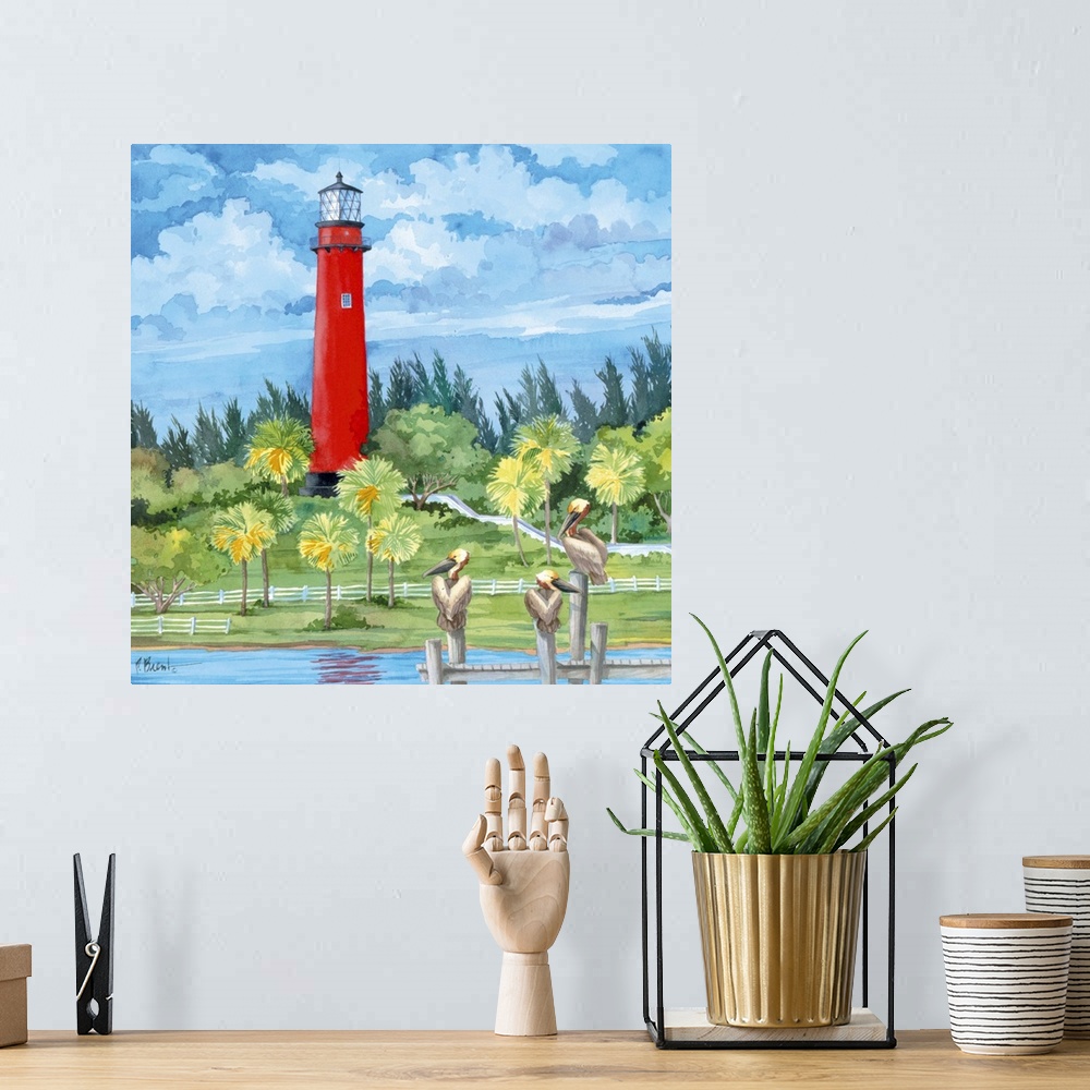 A bohemian room featuring Watercolor painting of a bright red lighthouse overlooking three pelicans perched on a pier.