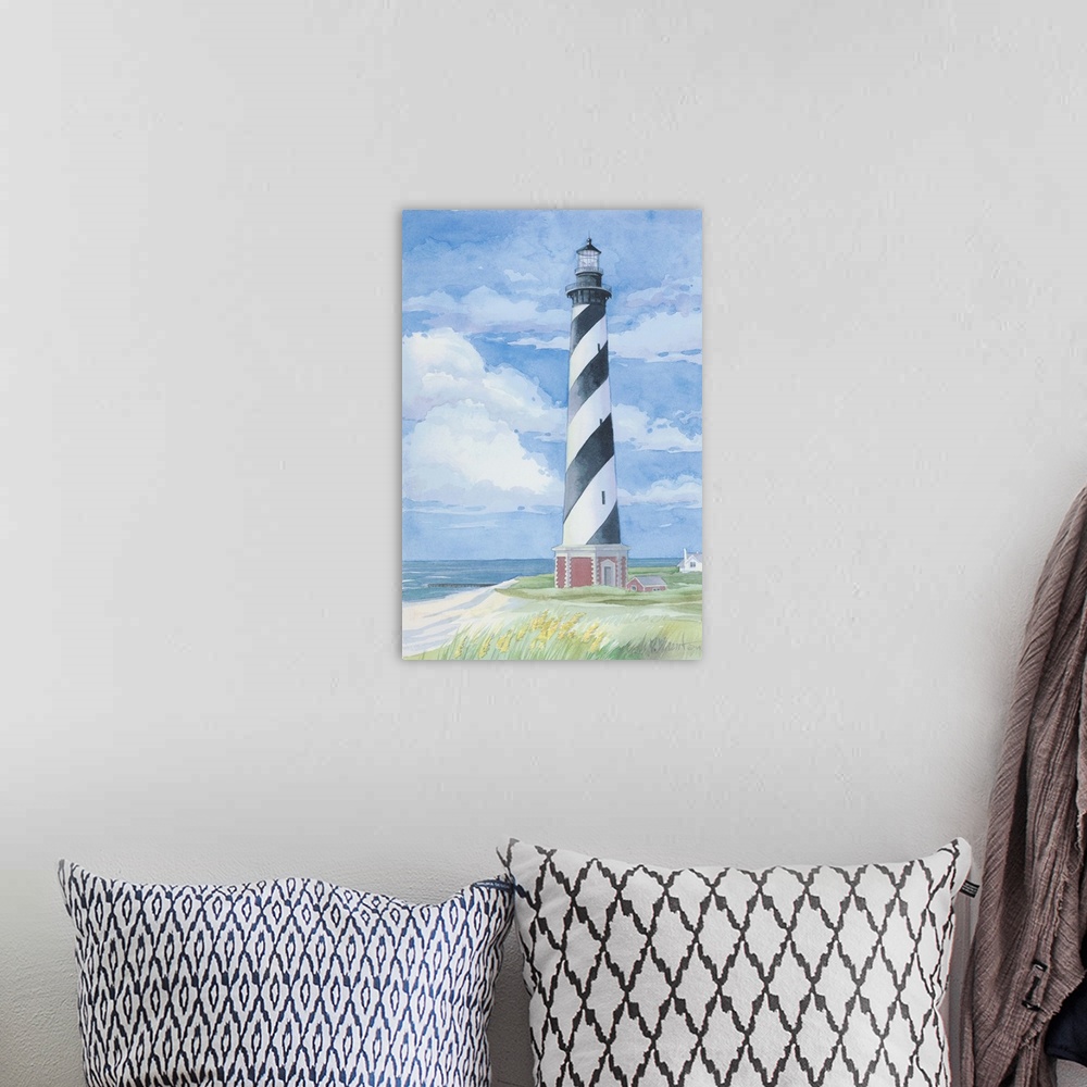 A bohemian room featuring Watercolor painting of the Cape Hatteras lighthouse on the Outer Banks, North Carolina.