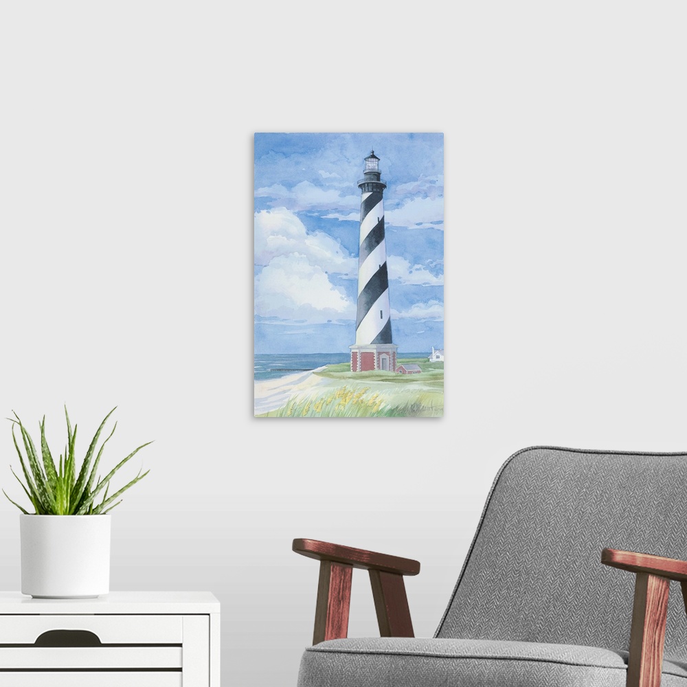 A modern room featuring Watercolor painting of the Cape Hatteras lighthouse on the Outer Banks, North Carolina.