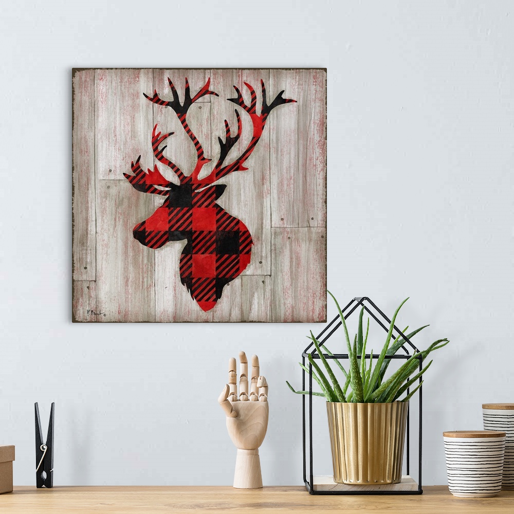 A bohemian room featuring Square cabin decor with a red and black flannel patterned silhouette of a deer on a faux distress...