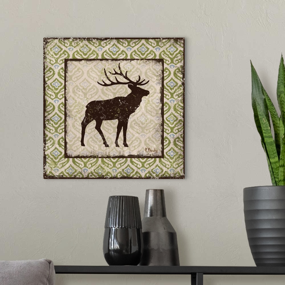 A modern room featuring Decorative square artwork featuring a silhouetted elk on a boho pattern.