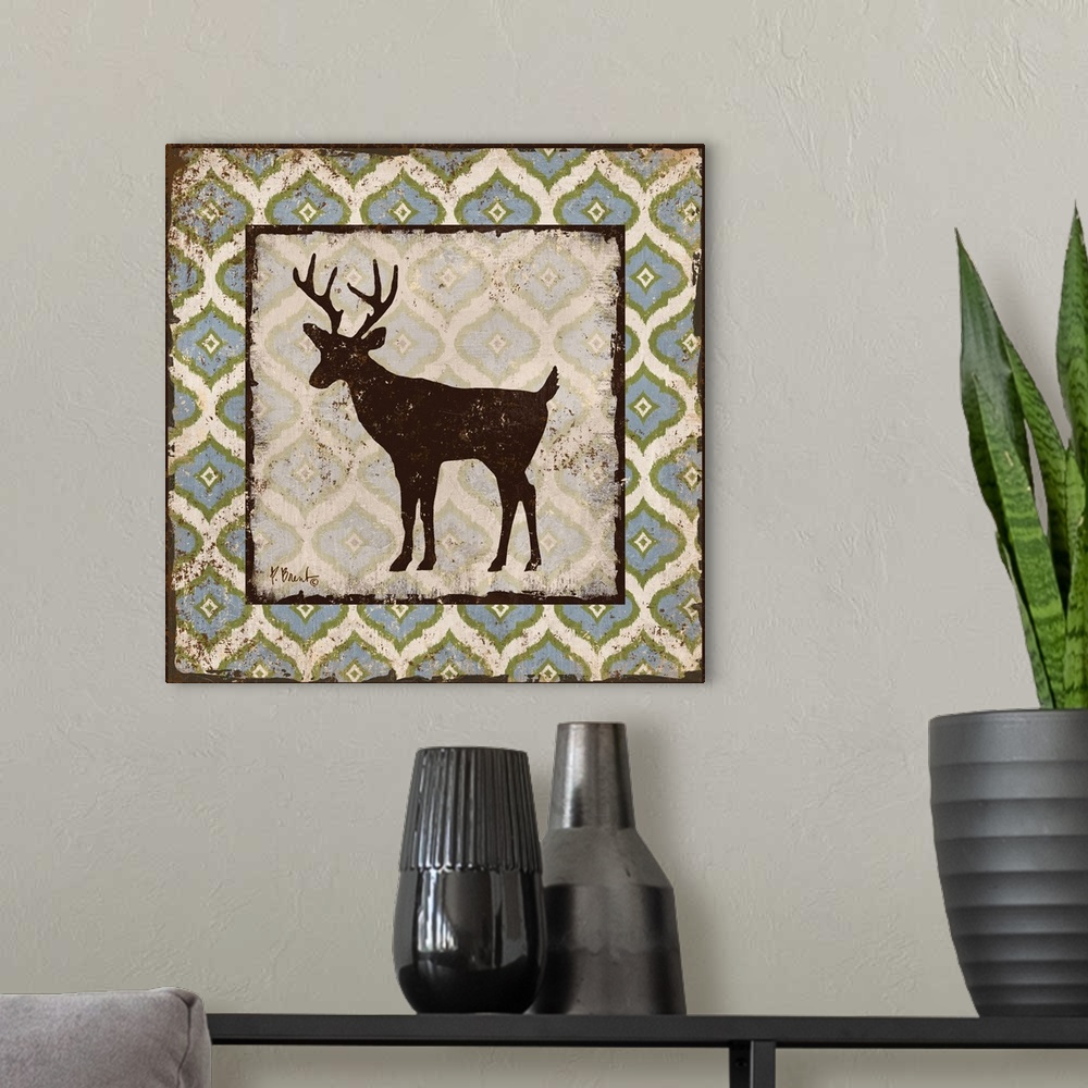 A modern room featuring Decorative square artwork featuring a silhouetted deer on a boho pattern.