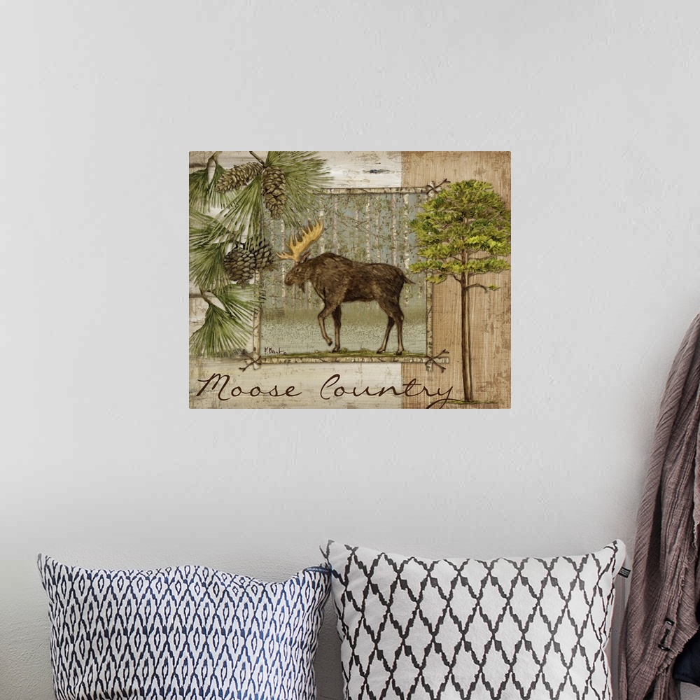 A bohemian room featuring Decorative artwork of a moose in a frame, with pine needles and pinecones, trees, and the words M...