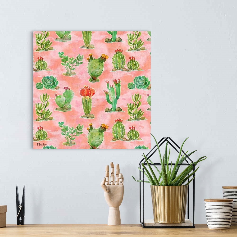 A bohemian room featuring Square watercolor painting of cacti and succulents on a light pink background.