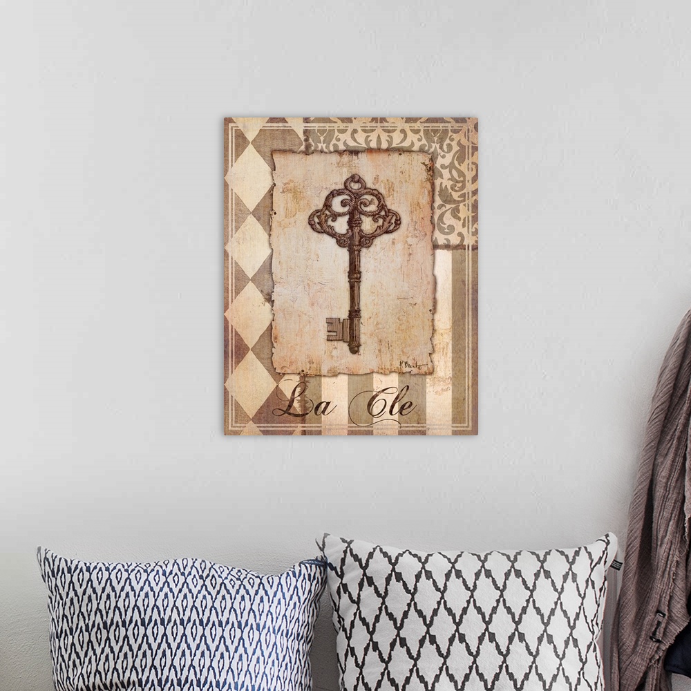 A bohemian room featuring Decorative sepia-toned artwork of a key with vintage patterns.