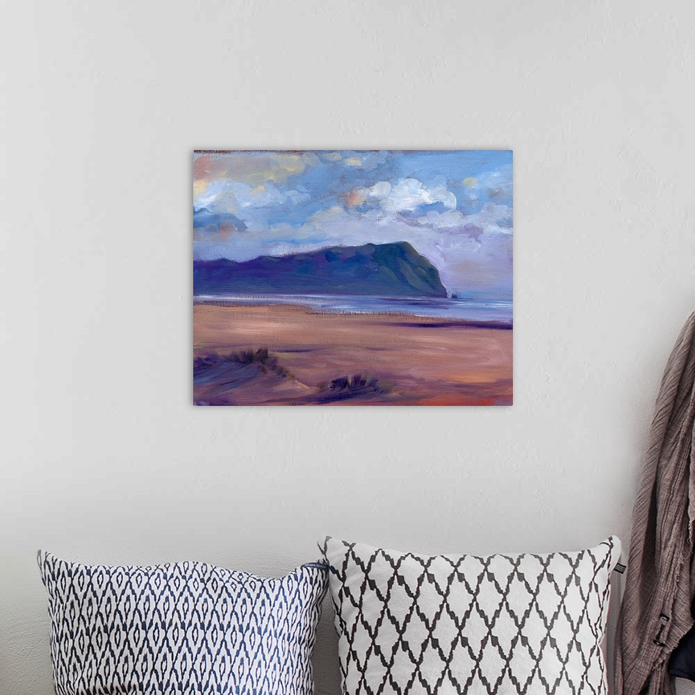 A bohemian room featuring Contemporary painting of a beach with a large rocky monument in the distance.