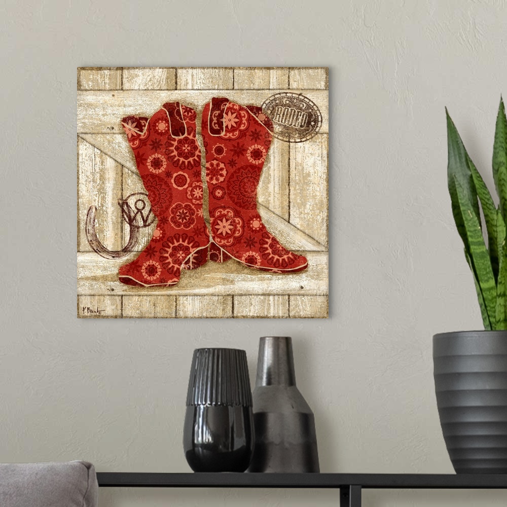 A modern room featuring Paisley patterned red cowboy boots with cattle brands.