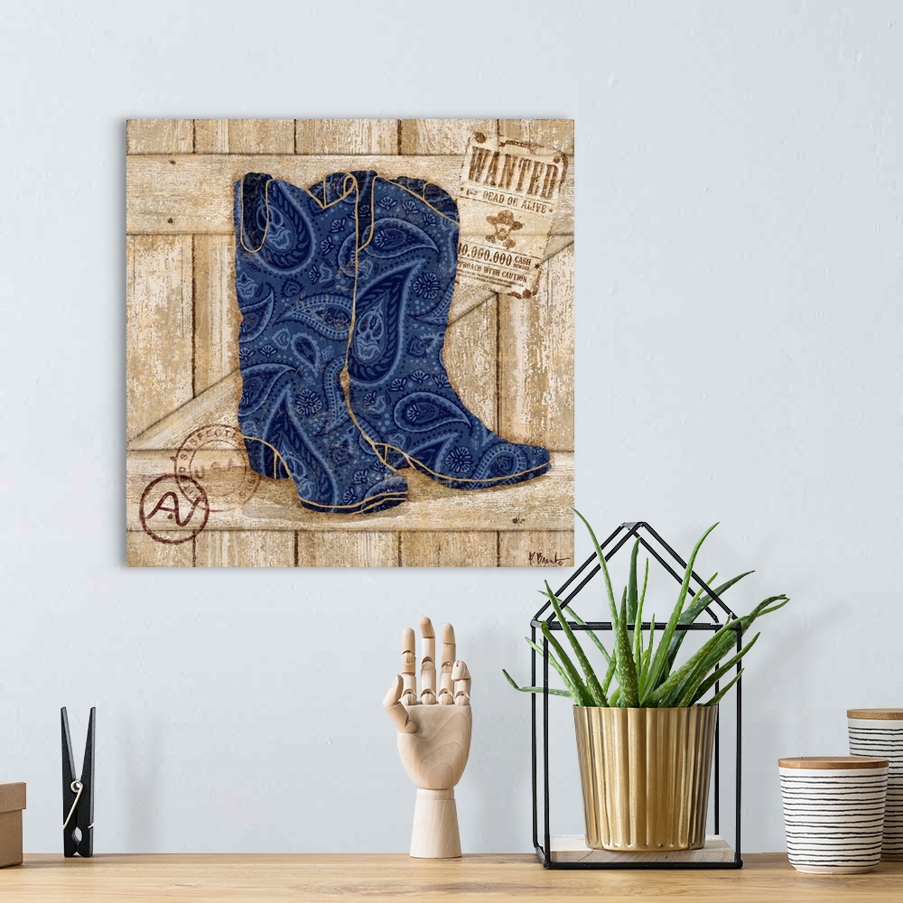 A bohemian room featuring Paisley patterned blue cowboy boots with cattle brands.
