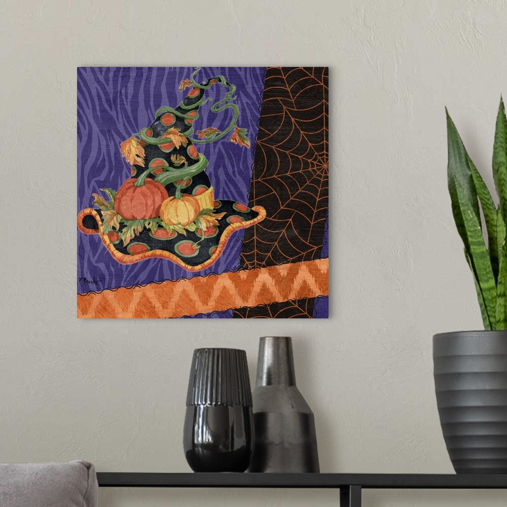 A modern room featuring Halloween themed artwork of a witch's pointy hat in festive purple and orange patterns.