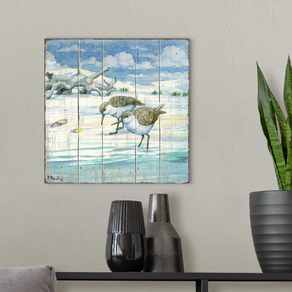 A modern room featuring Square painting on a faux wood background of two sandpipers grazing on the shore with driftwood i...