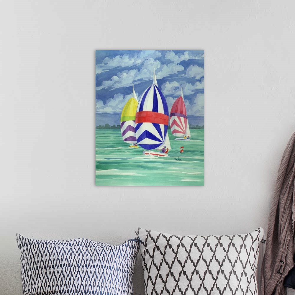 A bohemian room featuring Contemporary painting of three spinnaker boats with striped sails on the water.