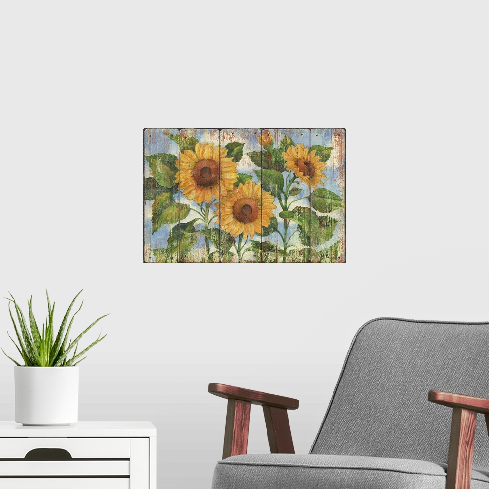 A modern room featuring Contemporary decorative artwork of three large sunflowers in full bloom on a textured panel backg...