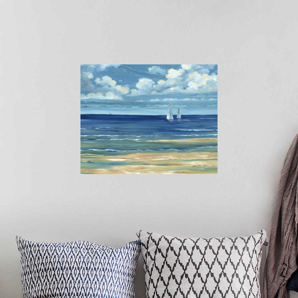 A bohemian room featuring Contemporary landscape painting of a deep blue ocean with white clouds overhead.