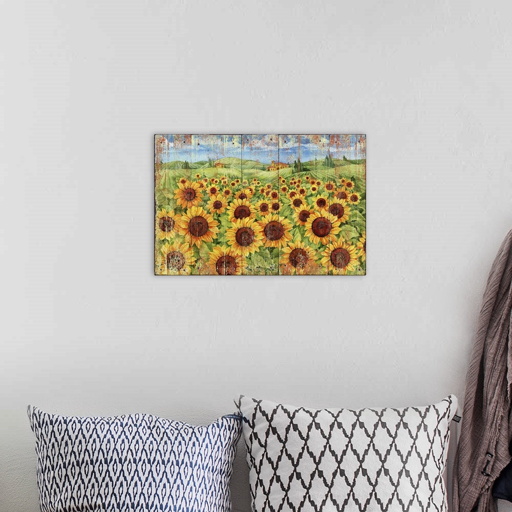 A bohemian room featuring Weathered painting of a field of sunflowers in the countryside.