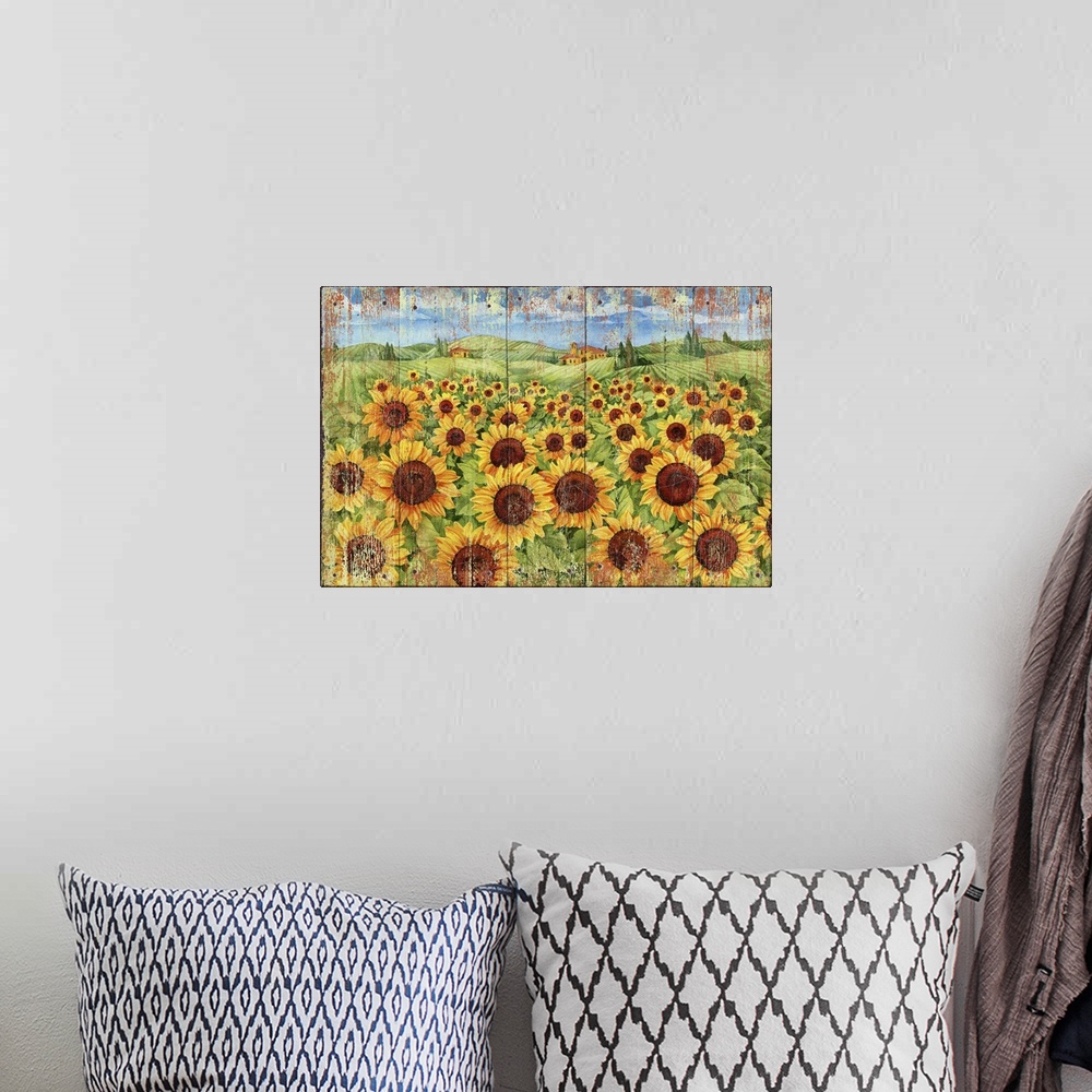 A bohemian room featuring Weathered painting of a field of sunflowers in the countryside.
