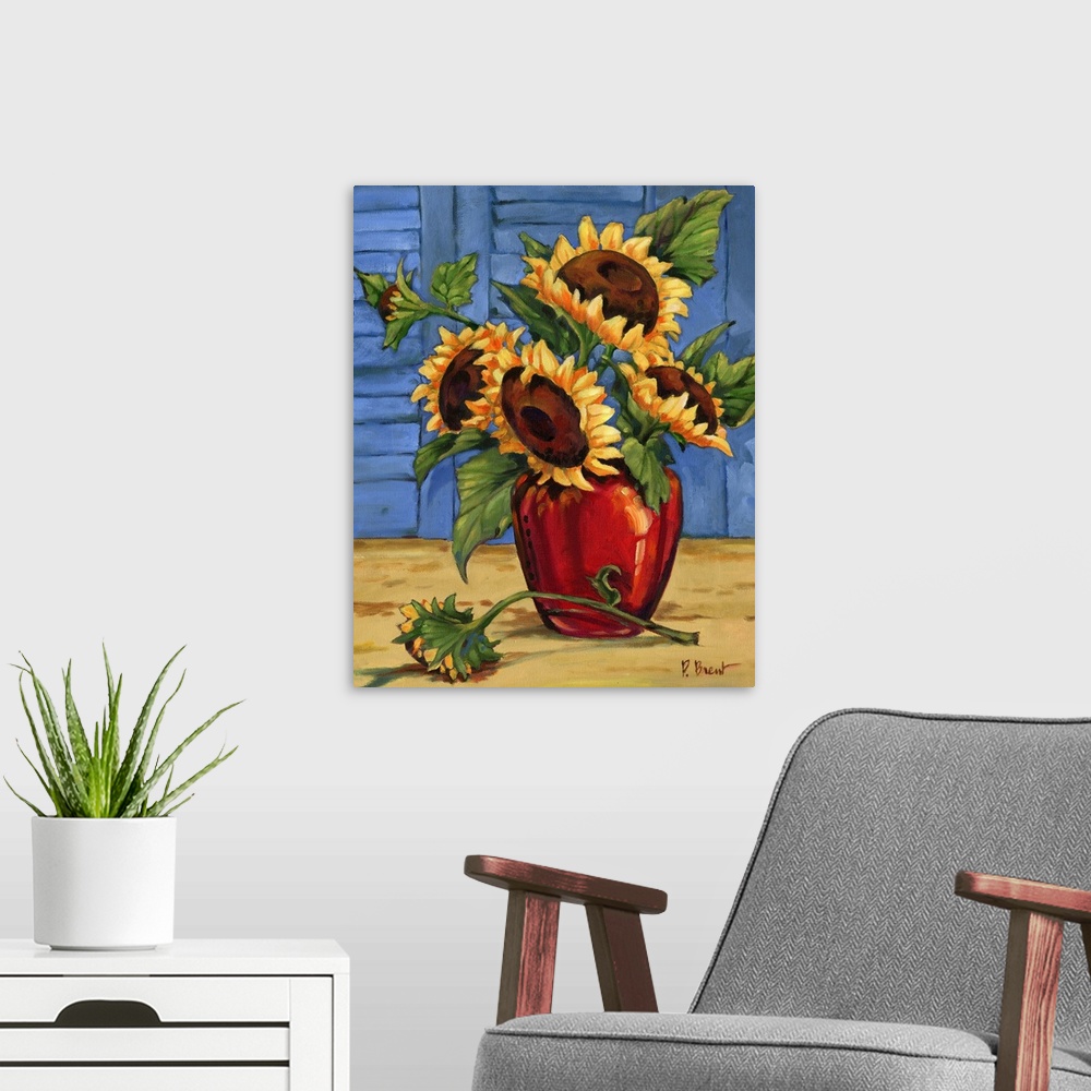 A modern room featuring Still life painting of an arrangement of sunflowers in a red vase against window shutters.
