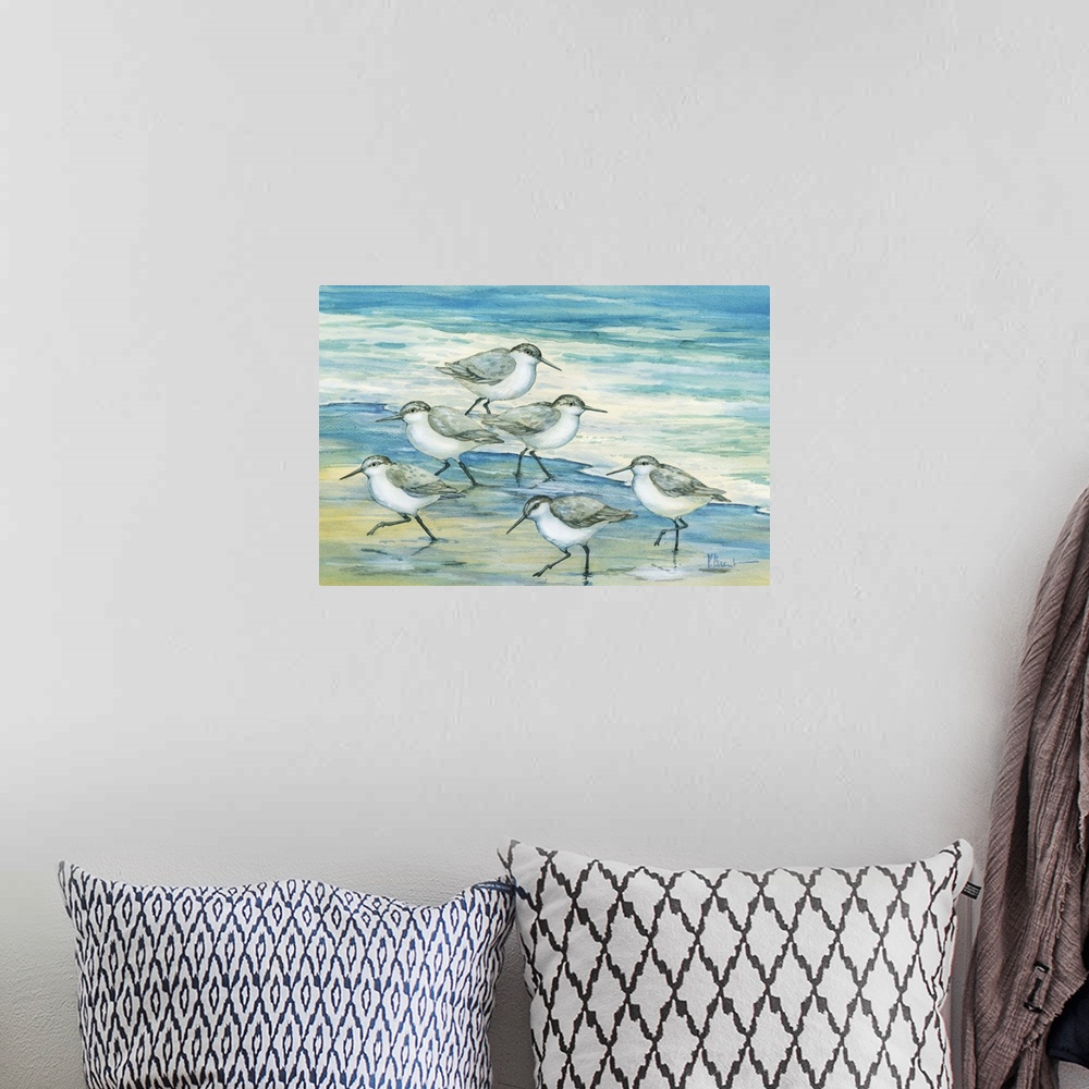A bohemian room featuring Contemporary artwork of a flock of sandpiper birds on the beach.