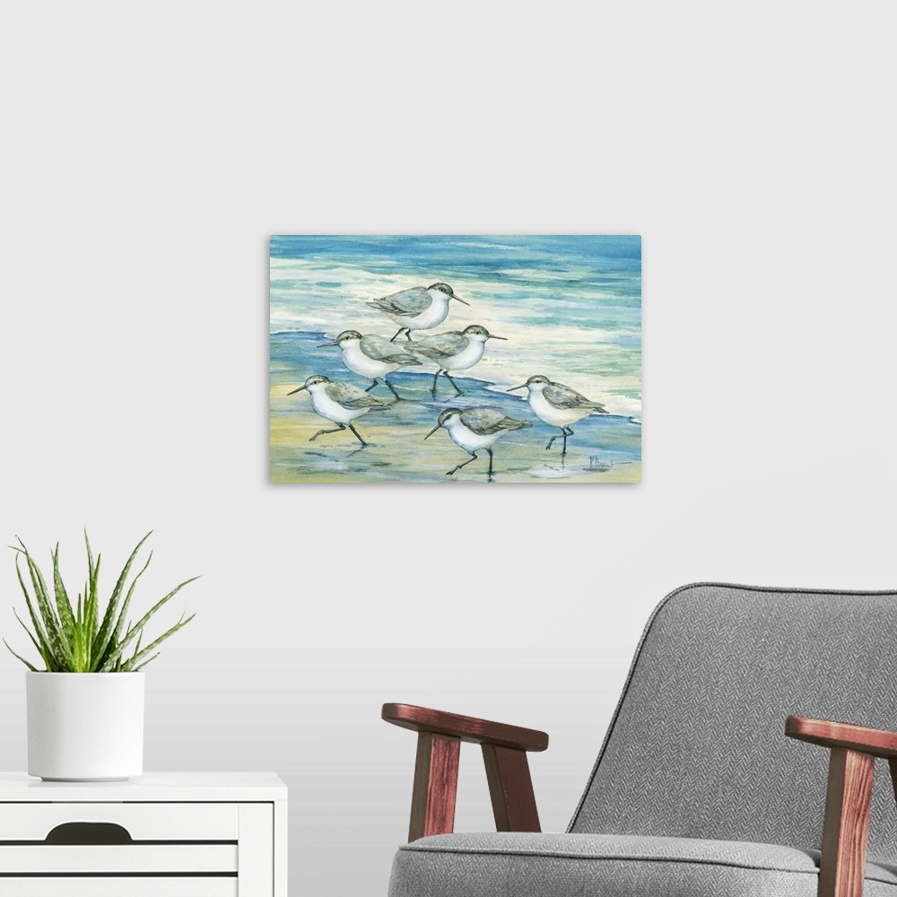 A modern room featuring Contemporary artwork of a flock of sandpiper birds on the beach.